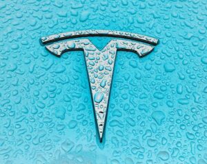 Tesla logo over cian