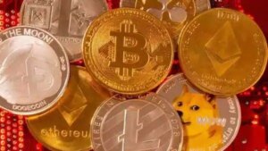 Representations of cryptocurrencies Bitcoin, Ethereum, DogeCoin, Ripple, Litecoin are placed on PC motherboard in this illustration. (REUTERS)