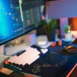 computer with mood lighting showing stock market data