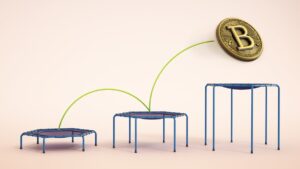 A coin with Bitcoin's logo bouncing higher on trampolines.