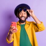 Surprised investor looking at smartphone.