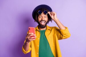 Surprised investor looking at smartphone.